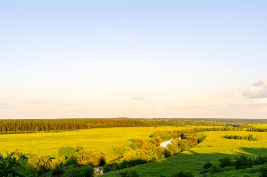 River and fields in the afternoon sun.