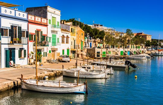 View of the beautiful harbor with colorful houses of Portocolom on Mallorca, Spain Balearic Islands