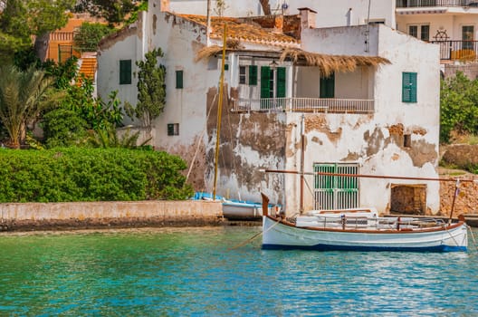 Idyllic view of old fishing boat moored at the coast of mediterranean village