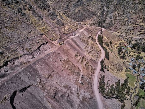 Aerial view of excavator on dangerous high-mountain road in Andes, South America
