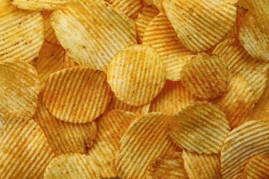 Corrugated Potato Chips. Food background. Top view