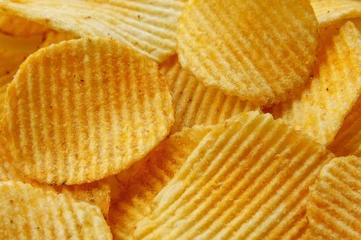 Corrugated Potato Chips. Food background. Top view