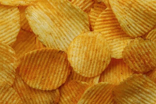 Corrugated Potato Chips. Food background. Top view