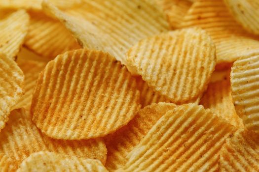 Corrugated Potato Chips. Food background. Top view