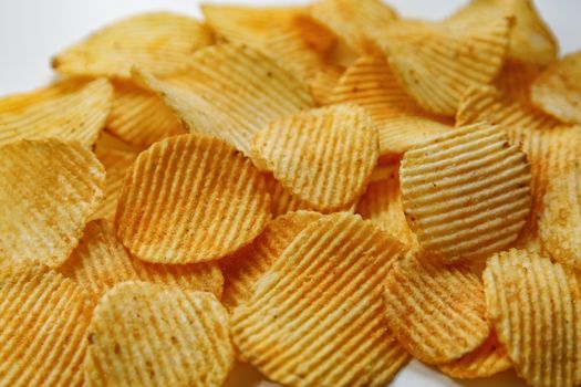 Corrugated Potato Chips. Food background. Top view