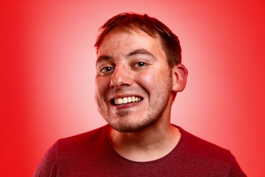 Smiling man on a red background