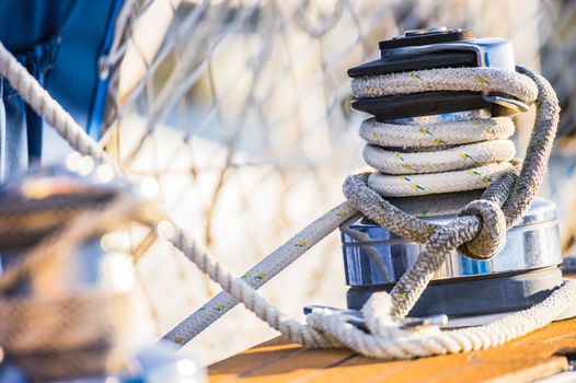 Detail image of winch and rope on sailing yacht boat deck