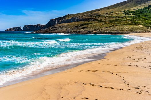 Footsteps on sandy beach, beautiful seaside on Majorca island, Spain