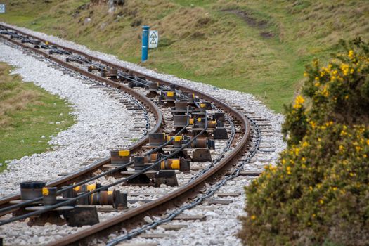 Close view of tram rail tracks showing the cable system which pulls the trams along