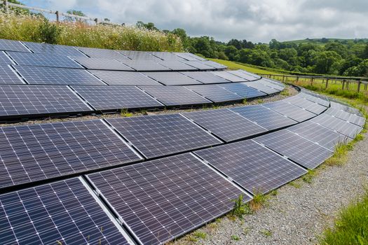 Solar panels mounted on the side of a hill