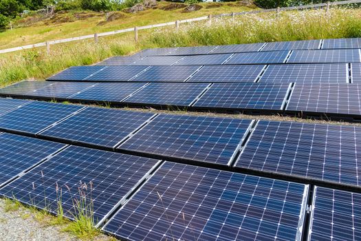 Solar panels mounted on the side of a hill