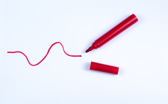 Hand drawn red line and pen isolated on a white background