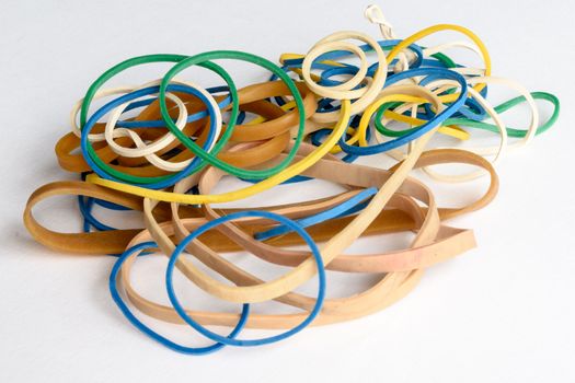 close up view of different coloured rubber bands