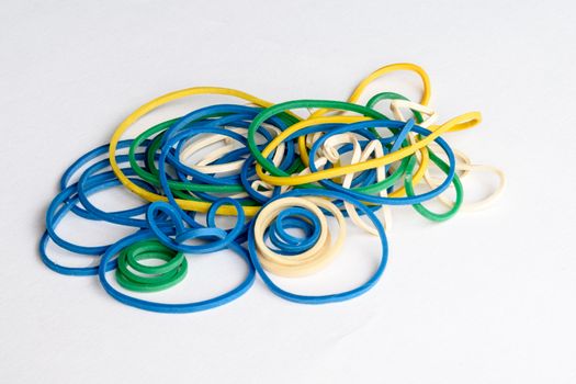 close up view of different coloured rubber bands