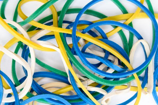 close up view of different coloured rubber bands