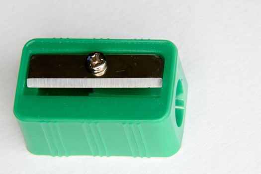 Green pencil sharpener on a white background