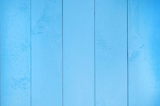 a top view surface formed by blue wooden planks