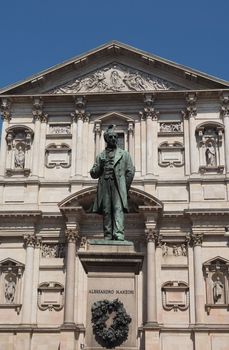 MILAN, ITALY - CIRCA APRIL 2018: Statue of writer Alessandro Manzoni in front of San Fedele church