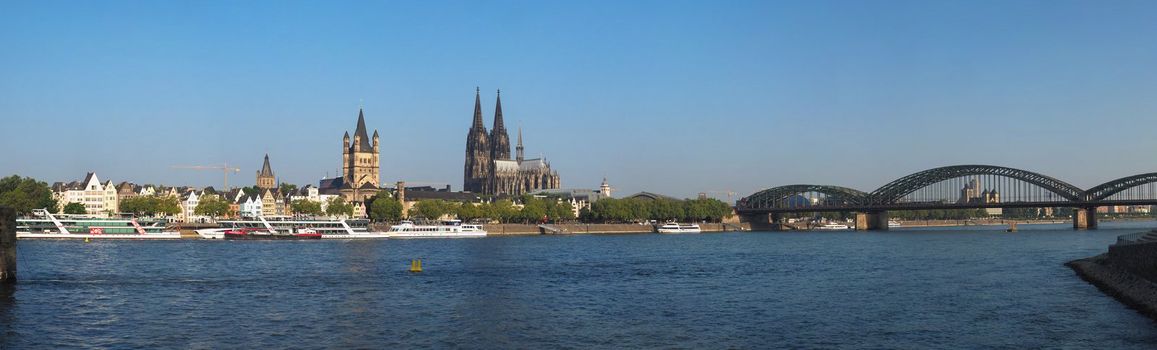 KOELN, GERMANY - CIRCA AUGUST 2019: Skyline of the city seen from river Rhein (Rhine). From Left To Right, The Altstadt (Old Town), Rathaus (Town Hall), Dom (Cathedral) And Hohenzollern Bridge