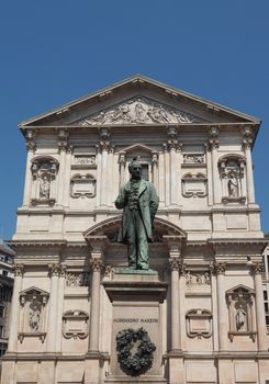 MILAN, ITALY - CIRCA APRIL 2018: Statue of writer Alessandro Manzoni in front of San Fedele church