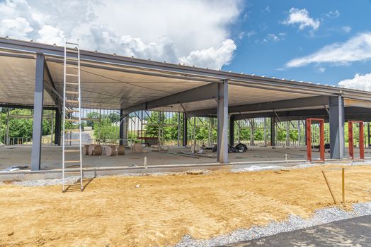 Horizontal shot of a commercial office building under construction.