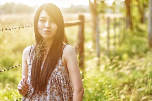 girl smiling in a meadow - happy girl