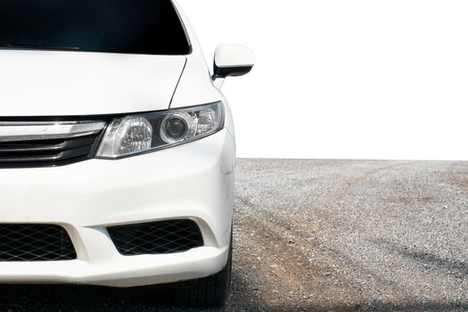 Close up front of white car in street on white background