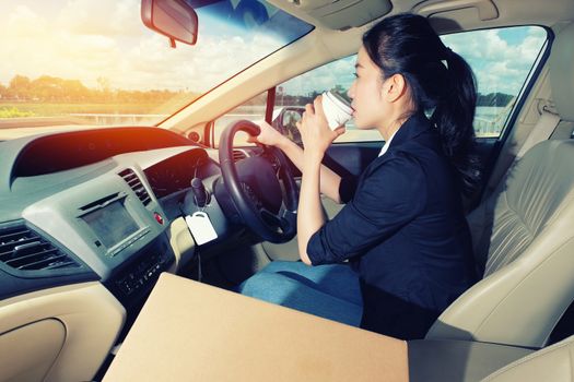 Young Girl drinking Coffee Before going to drive her car.