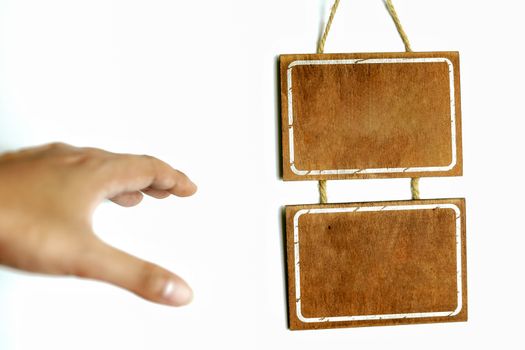 Men's hands and wooden signs without text on a white background