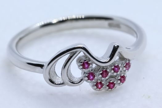 macro shot of pink stone silver ring with white background