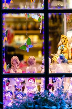 The window through which the visible Christmas decorations. Christmas time concept - image