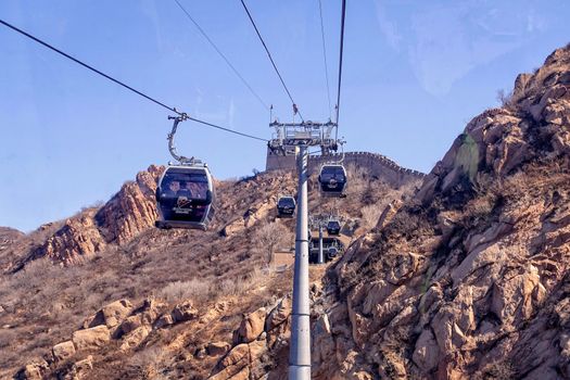 BADALING, CHINA - MARCH  13, 2016: Great Wall of China. A cable car taking visitors up to the Great Wall of China.
