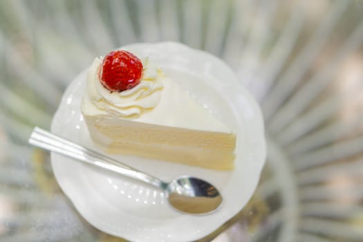 Closeup Milk cake delicious on glass table background, selective focus