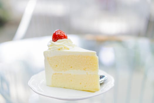 Closeup Milk cake delicious on glass table background, selective focus