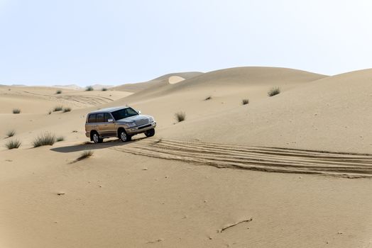 One 4x4 vehicle off-roading in the red sand dunes of Dubai Emirates, United Arab Emirates