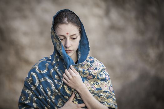 The girl of the European appearance is covered with a sari