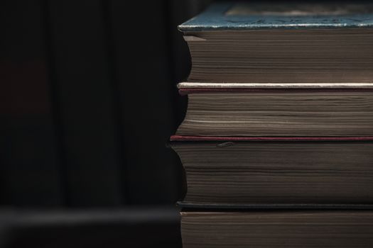 The pile of books lies on a table, a background, other pile, knowledge, library