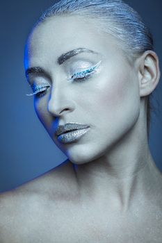 Portraits of a young fashion model as ice queen.