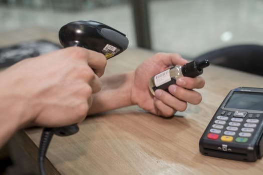 The seller scans a bar code on goods