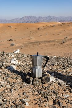 Italian Coffee maker at a fireplace in the desert