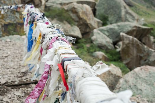 Ribbons of desires attached to a handrail