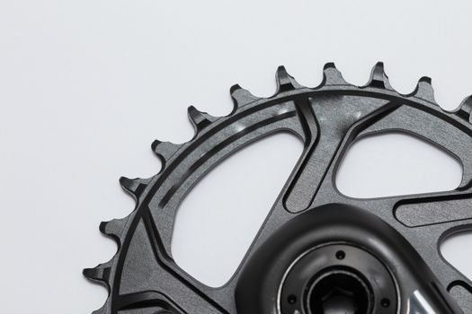 A bicycle front chainring ready to be installed onto a mountain bike