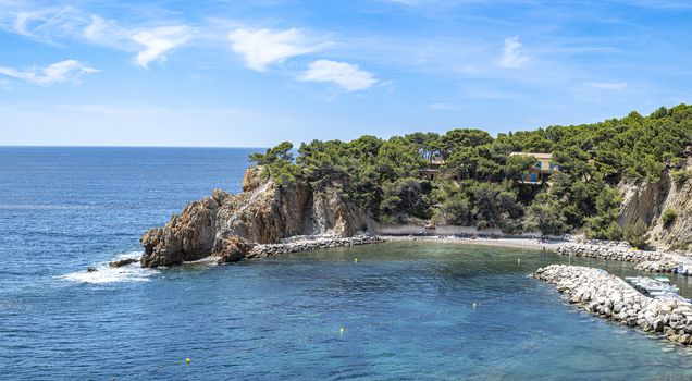 Port and pebble beach of  Calanques of Figuieres, creek of Figuieres and Figuières Cove in Méjean during summer, South of France, Europe