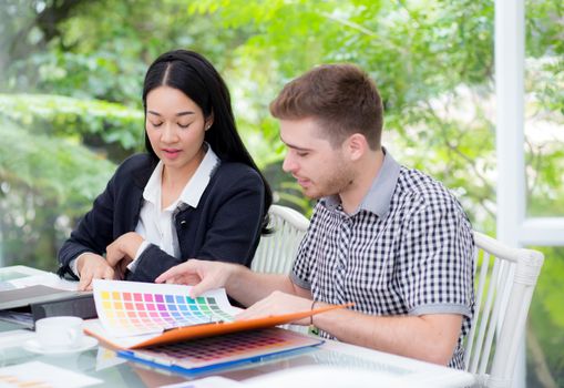 young business people making meeting and looking at document for analyzing marketing working at office on desk.