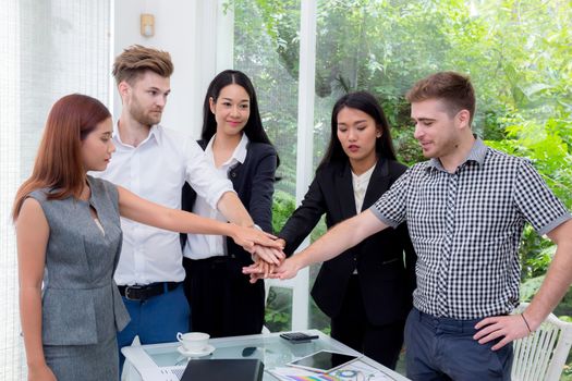 Group of business people join the hand or group teamwork concept.