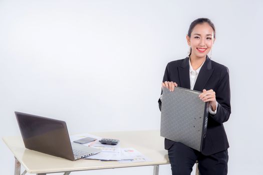 businesswoman hold file document looking camera with sitting table in office on white background.