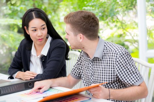 young business people making meeting and looking at document for analyzing marketing working at office on desk.