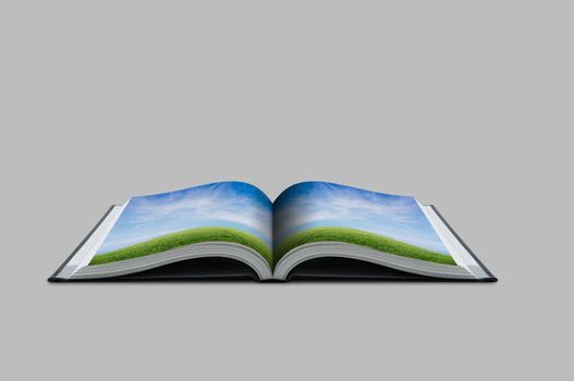 Open book with meadow and sky environment concept.