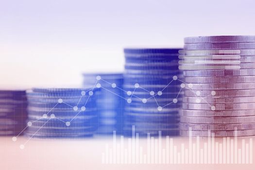 Double exposure in blue tone of graph and coins for finance - business concept.