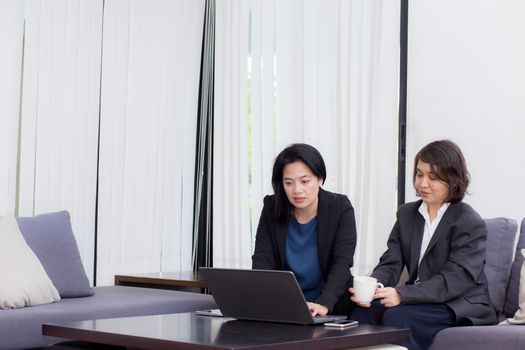 senior and junior businesswoman discuss something during their meeting.